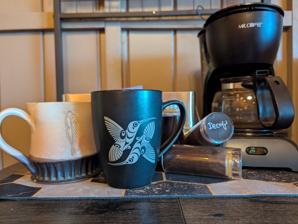 coffee mugs, grounds, and maker